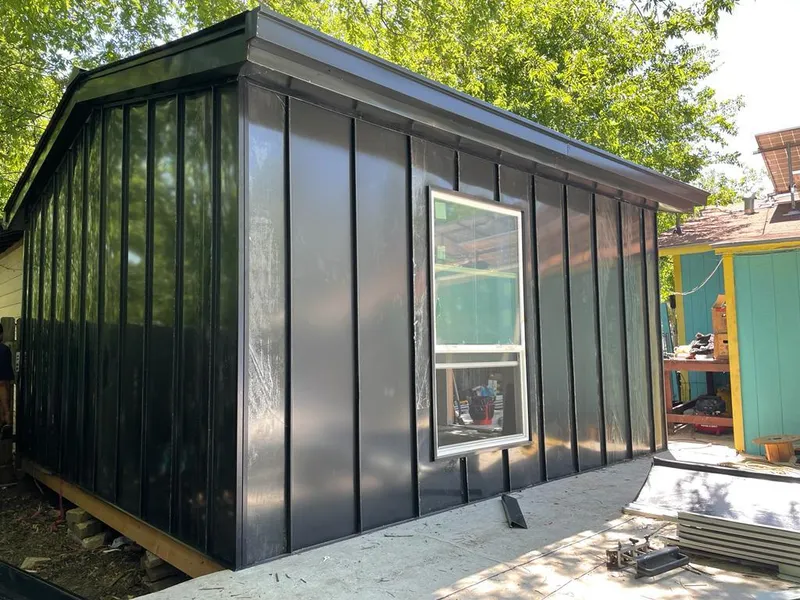 Black standing seam metal wall panels for Roof Inspection in Woodhaven