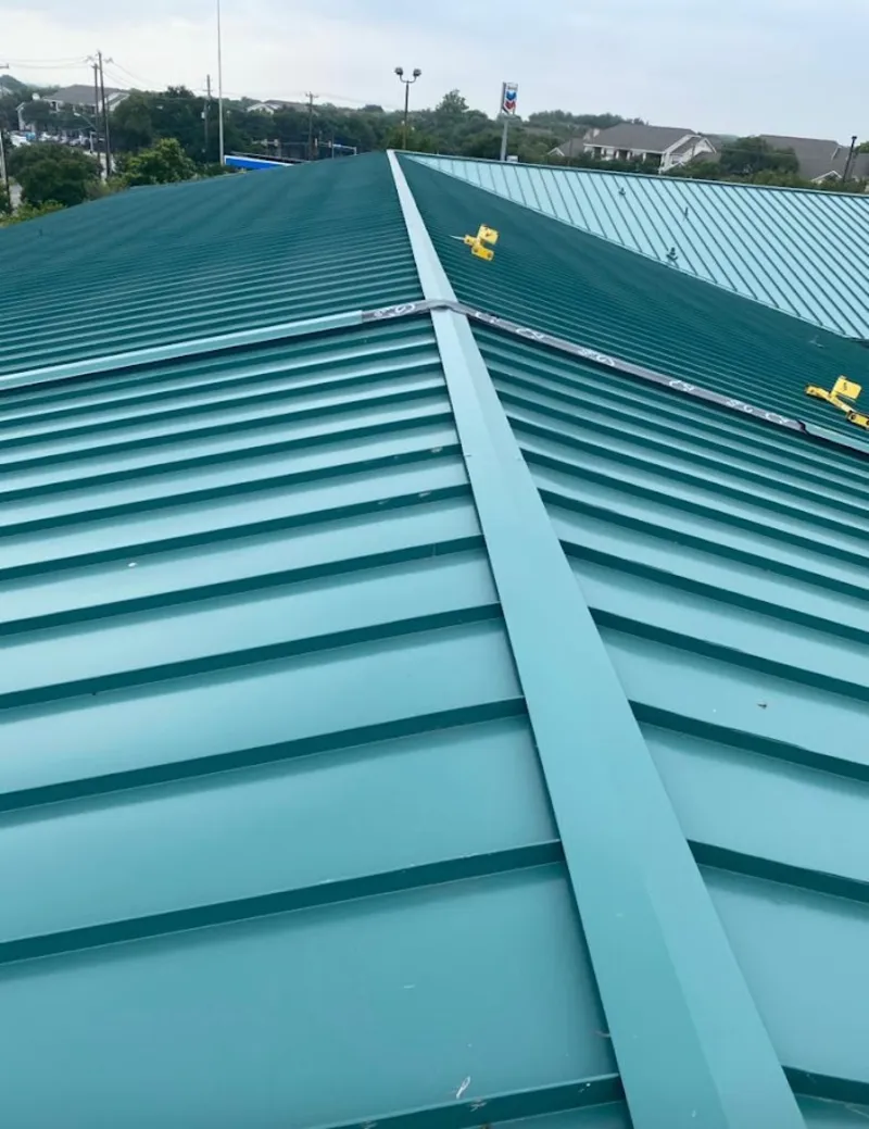 Green commercial metal roof ridge and valley for Metal Roof Repair in Woodhaven
